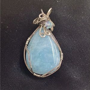 Aquamarine hand wrapped in sterling silver wire